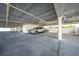 Covered parking area featuring car, storage and bike parking at 1501 Beach Rd # 310, Englewood, FL 34223