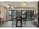 Relaxing screened patio with a high top table and chairs, perfect for enjoying the outdoor views at 1501 Beach Rd # 310, Englewood, FL 34223