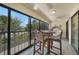 Inviting patio with high top table and comfortable seating, offering beautiful views of the surrounding landscape at 1501 Beach Rd # 310, Englewood, FL 34223