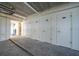 Indoor storage area with multiple white storage lockers numbered 206 to 210 at 1501 Beach Rd # 310, Englewood, FL 34223