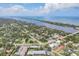 Aerial view highlighting community's proximity to the water and local neighborhoods at 1730 Manasota Beach Rd # 204, Englewood, FL 34223