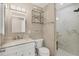 Bathroom features include marble countertop, glass shower, modern fixtures, and floating shelves at 1730 Manasota Beach Rd # 204, Englewood, FL 34223