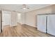 Bedroom with ceiling fan, modern floors, and closet at 1730 Manasota Beach Rd # 204, Englewood, FL 34223
