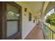 Exterior view of unit 204 showing covered walkway at 1730 Manasota Beach Rd # 204, Englewood, FL 34223