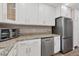 Kitchen view with stainless steel appliances, granite countertops and white cabinets at 1730 Manasota Beach Rd # 204, Englewood, FL 34223