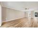 Open-concept living area with wood-look floors, neutral paint at 1730 Manasota Beach Rd # 204, Englewood, FL 34223