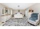 Spacious bedroom with neutral walls, ornate mirror, plush rug, and private entry at 209 Fairway Rd, Rotonda West, FL 33947