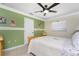 Inviting bedroom with vibrant green accents, paired with neutral tones for a refreshing and peaceful ambiance at 209 Fairway Rd, Rotonda West, FL 33947