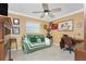 Relaxing bedroom featuring a comfortable couch, desk, and inviting decor creating a perfect retreat within the home at 209 Fairway Rd, Rotonda West, FL 33947