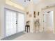 Bright foyer with tiled floor, decorative accents, and natural light from large windows at 209 Fairway Rd, Rotonda West, FL 33947