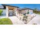 Attractive home exterior featuring a well-manicured lawn, decorative statues, stone facade, and a charming front entrance at 209 Fairway Rd, Rotonda West, FL 33947