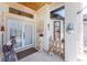 A beautifully decorated front porch featuring detailed stone pillars and a decorative stone facade above the entrance at 209 Fairway Rd, Rotonda West, FL 33947