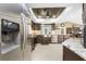 Open kitchen with stainless steel appliances, and stylish countertops boasts ample counter space and modern design at 209 Fairway Rd, Rotonda West, FL 33947