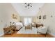Inviting living room features a vaulted ceiling, light-colored walls, wood floors, and bright, natural light at 209 Fairway Rd, Rotonda West, FL 33947
