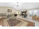 Cozy living room leading to an open kitchenette featuring lots of space and traditional furniture at 209 Fairway Rd, Rotonda West, FL 33947