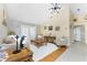 Cozy living room with wood floors, nice furniture and an interesting display of decor throughout the room at 209 Fairway Rd, Rotonda West, FL 33947