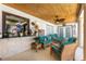 Inviting outdoor patio with comfortable seating, wood ceiling, and relaxing atmosphere for entertaining or unwinding at 209 Fairway Rd, Rotonda West, FL 33947