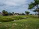 Landscaped backyard featuring a serene canal view, enhancing the home's tranquility and outdoor appeal at 21 Sportsman Way, Rotonda West, FL 33947