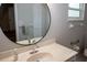 Bright bathroom featuring a stylish mirror, sink and vanity with tiled floors at 21 Sportsman Way, Rotonda West, FL 33947