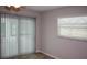 Bedroom with wood-look flooring and natural light from vertical blinds and a window at 21 Sportsman Way, Rotonda West, FL 33947