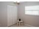 Bedroom featuring white closet doors, a window with blinds, and tiled floors at 21 Sportsman Way, Rotonda West, FL 33947