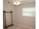 Bedroom with tile floor and window with mini blinds at 21 Sportsman Way, Rotonda West, FL 33947
