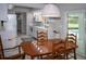 Open dining area offering easy access to the kitchen and backyard pool at 21 Sportsman Way, Rotonda West, FL 33947