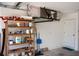 Garage with storage shelves above head and door to interior adds convenience and storage solutions at 21 Sportsman Way, Rotonda West, FL 33947
