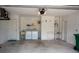 Spacious garage featuring a laundry area, storage, and ample room for vehicles, blending functionality and convenience at 21 Sportsman Way, Rotonda West, FL 33947