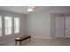 Spacious living room with neutral colors, vaulted ceiling, large windows, and tiled floor at 21 Sportsman Way, Rotonda West, FL 33947