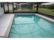 Backyard swimming pool and screen enclosed porch at 21 Sportsman Way, Rotonda West, FL 33947