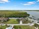 Aerial view of a waterfront home on a lush green lot at 2295 Chilcote Ter, Port Charlotte, FL 33981