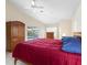 Bedroom featuring wood furniture, large closet, plush carpet, vaulted ceilings and sliding door to pool at 2295 Chilcote Ter, Port Charlotte, FL 33981