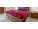 Cozy bedroom with wood furniture, soft lighting, and comfortable bedding for restful nights at 2295 Chilcote Ter, Port Charlotte, FL 33981