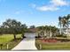 Charming single-story home with well-maintained landscaping, mature trees, and a spacious two-car garage at 2295 Chilcote Ter, Port Charlotte, FL 33981