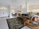 Open living area with tile entry, plush carpet, vaulted ceilings, adjacent to dining area and front entry at 2295 Chilcote Ter, Port Charlotte, FL 33981