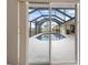 Inviting screened-in pool area with a clear view of the waterfront, perfect for relaxation and entertainment at 2295 Chilcote Ter, Port Charlotte, FL 33981