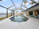 Sparkling screened-in pool with serene waterfront views at 2295 Chilcote Ter, Port Charlotte, FL 33981