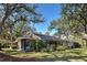 Exterior view of the home showcasing a well-manicured lawn and large windows for ample natural light at 232 Southampton Ln # 259, Venice, FL 34293