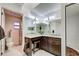 Bathroom with a makeup vanity, granite countertops, toilet, and shower with a floral curtain at 232 Southampton Ln # 259, Venice, FL 34293