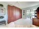Spacious room with built in storage, a ceiling fan, and access to the patio at 232 Southampton Ln # 259, Venice, FL 34293