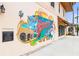 A colorful and artistic mural on the side of a building in Venice's Main Street at 232 Southampton Ln # 259, Venice, FL 34293