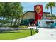 Modern community building with vibrant branding, offering lakeside dining, bike rentals, and convenient parking at 232 Southampton Ln # 259, Venice, FL 34293