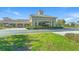 Exterior shot of the Venice Community Center with well-maintained landscaping and ample parking at 232 Southampton Ln # 259, Venice, FL 34293