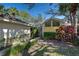 Well-maintained, single-story home with vibrant landscaping, unique window, and inviting walkway at 232 Southampton Ln # 259, Venice, FL 34293