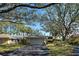 Charming single-story home showcases a two-car garage, mature trees, and well-maintained landscaping at 232 Southampton Ln # 259, Venice, FL 34293
