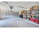 Spacious two-car garage with ample storage shelving, ideal for organization and convenience at 232 Southampton Ln # 259, Venice, FL 34293