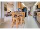 Open-concept kitchen with bar seating that connects to the living area at 232 Southampton Ln # 259, Venice, FL 34293