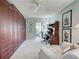Office with built in storage, a ceiling fan, and white loveseat at 232 Southampton Ln # 259, Venice, FL 34293