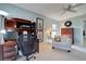 Bright office with a ceiling fan, desk, and white loveseat at 232 Southampton Ln # 259, Venice, FL 34293
